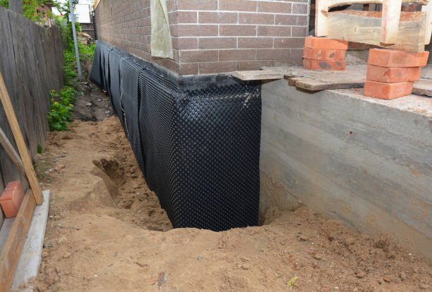 SJ Waterproofing Pros technician performing targeted Waterproofing assessment in New London, OH